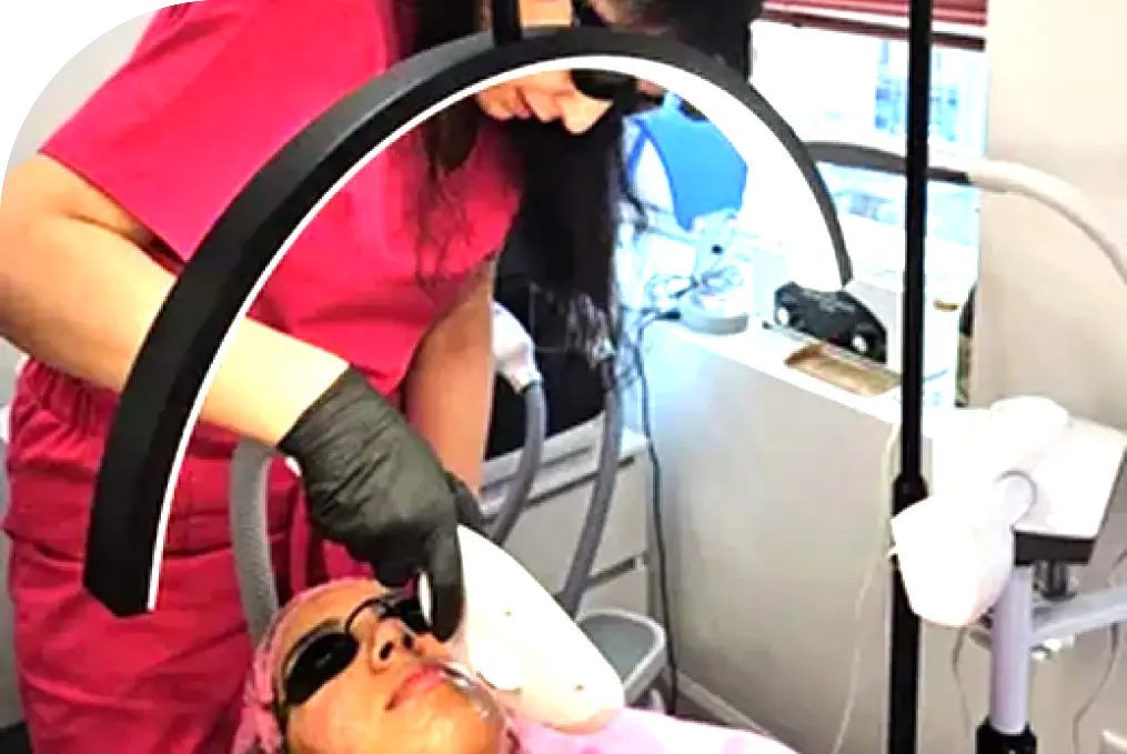 Maya performing an IPL skin treatment at her Midtown Manhattan studio